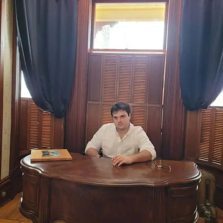 Ornate wooden desk with decorative legs evoking memories of a life crisis years ago.