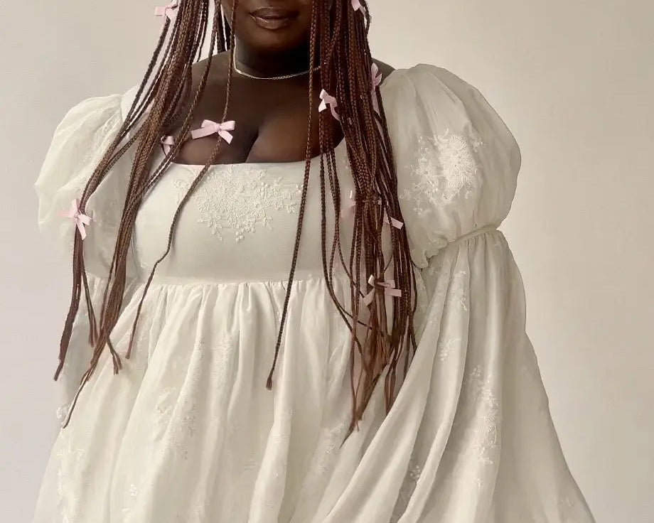 Ivory fairy puff dress featuring puffy sleeves and a square neckline for stylish looks.