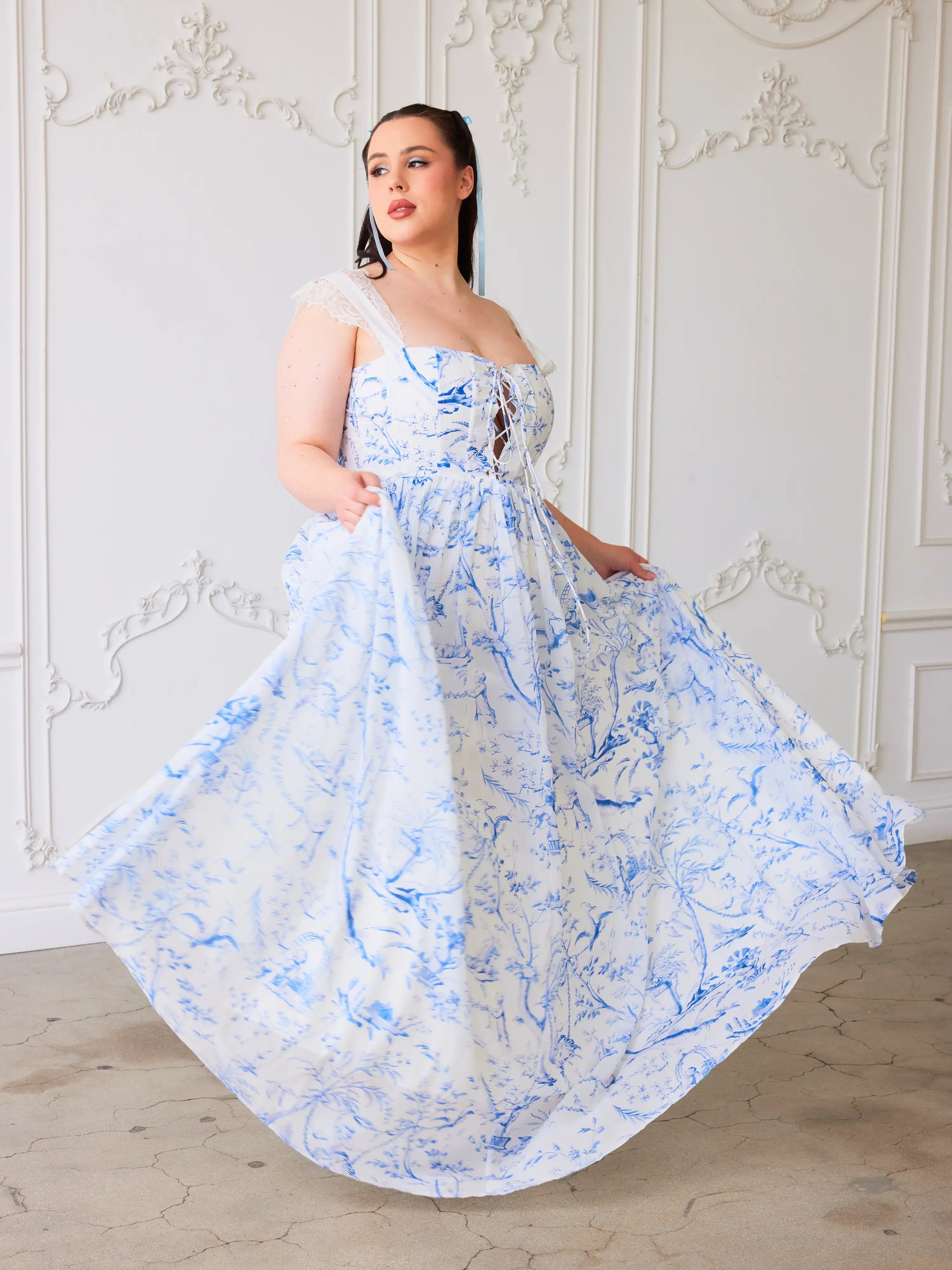 The Blue Toile Lovers Gown - The Lovers Gown; a poetic expression of romance and elegance, rendered in the timeless beauty of blue toile. This gown is a sartorial sonnet, crafted for those who find their hearts intertwined with the threads of whimsy and w