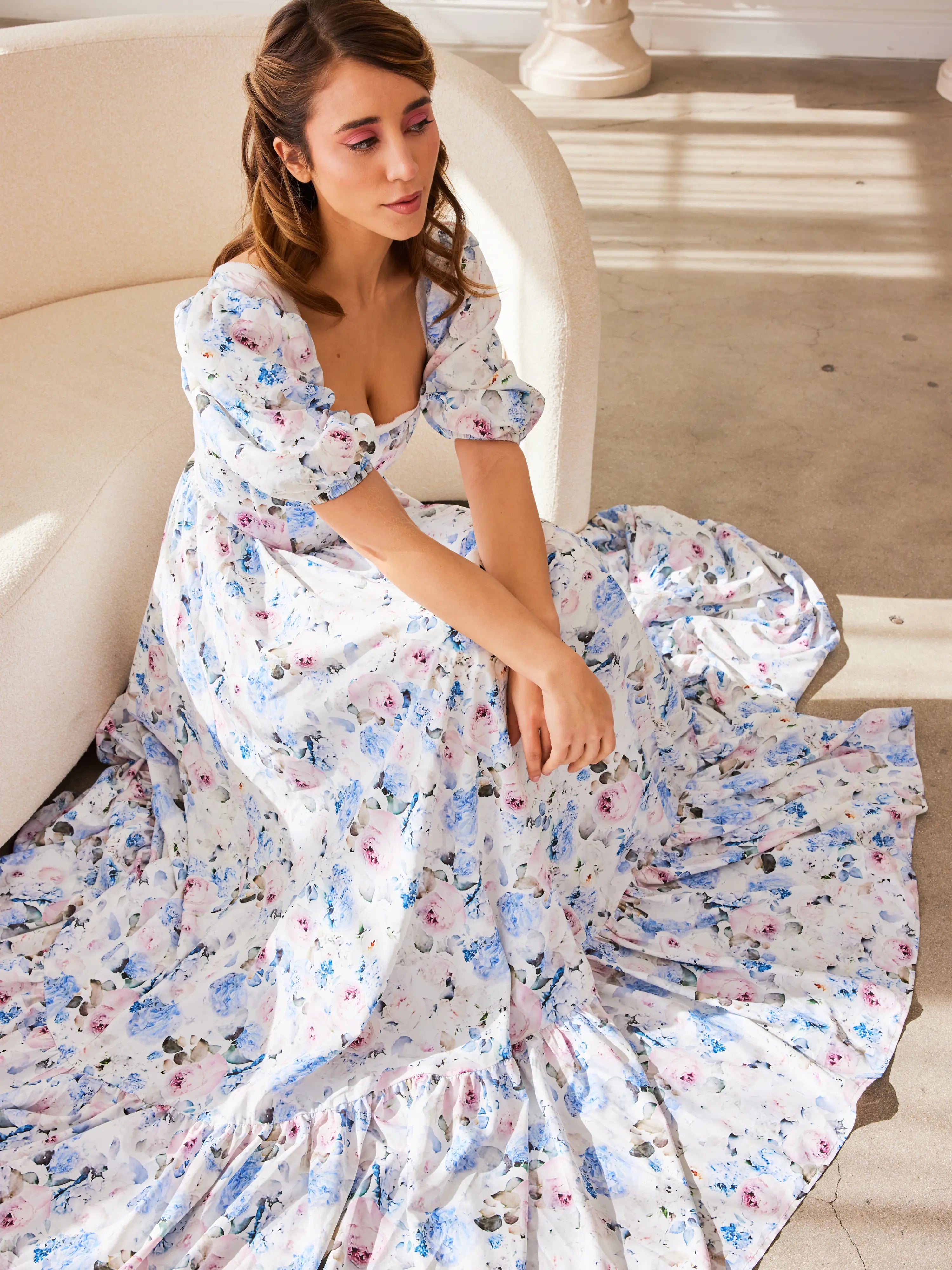 The Wild Bloom Josephine Gown - Introducing the Josephine Gown, a masterpiece woven from the fabric of dreams, adorned in a mesmerizing Wild Bloom floral pattern. This gown is a testament to the beauty of contrast and the elegance of design, created for t