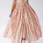 Detail of Twilight Bloom Meadow Gown's front slit and floral print, highlighting movement and texture of the skirt.