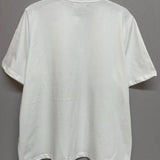 Back view of The Princess Kitten Tee on hanger, displaying the plain white cotton fabric and relaxed oversized fit.