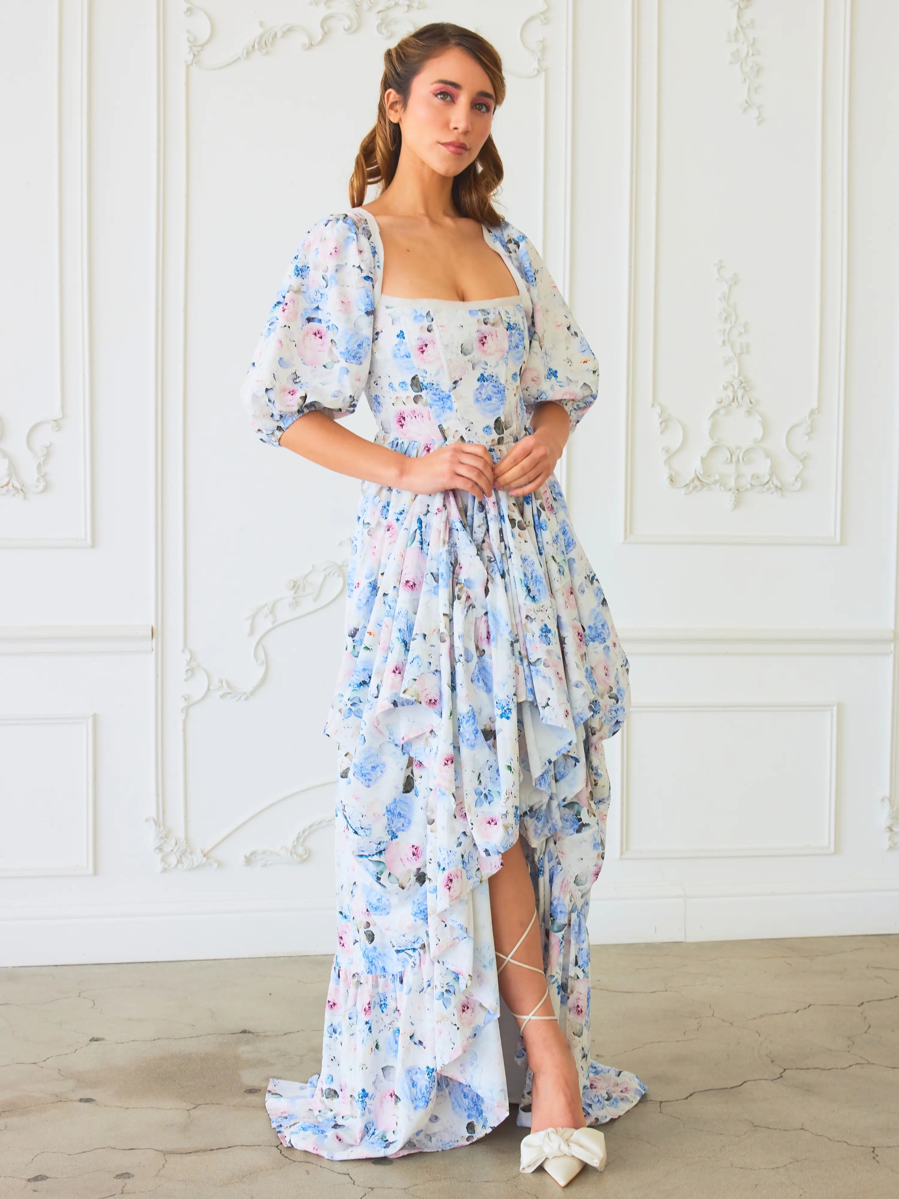 The Wild Bloom Josephine Gown - Introducing the Josephine Gown, a masterpiece woven from the fabric of dreams, adorned in a mesmerizing Wild Bloom floral pattern. This gown is a testament to the beauty of contrast and the elegance of design, created for t
