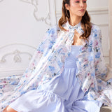 The Wild Bloom Priestess Cape - Unveil the majesty of the Wild Bloom Priestess Cape, a masterpiece crafted from over 10 yards of ethereal poly organza. This cape is not merely a garment but a declaration of grace and mystique, adorned with the enchanting
