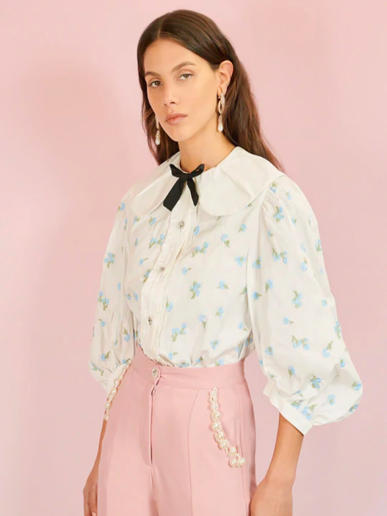 Lapis Shell Blouse - The Lapis Shell Blouse by SisterJane is a bow blouse in a floral embroidered cotton fabric. Featuring a pleated round collar and ruffle placket with stand out gem buttons. Detailed with oversized mid length sleeves. - Ivory Sheep Coll