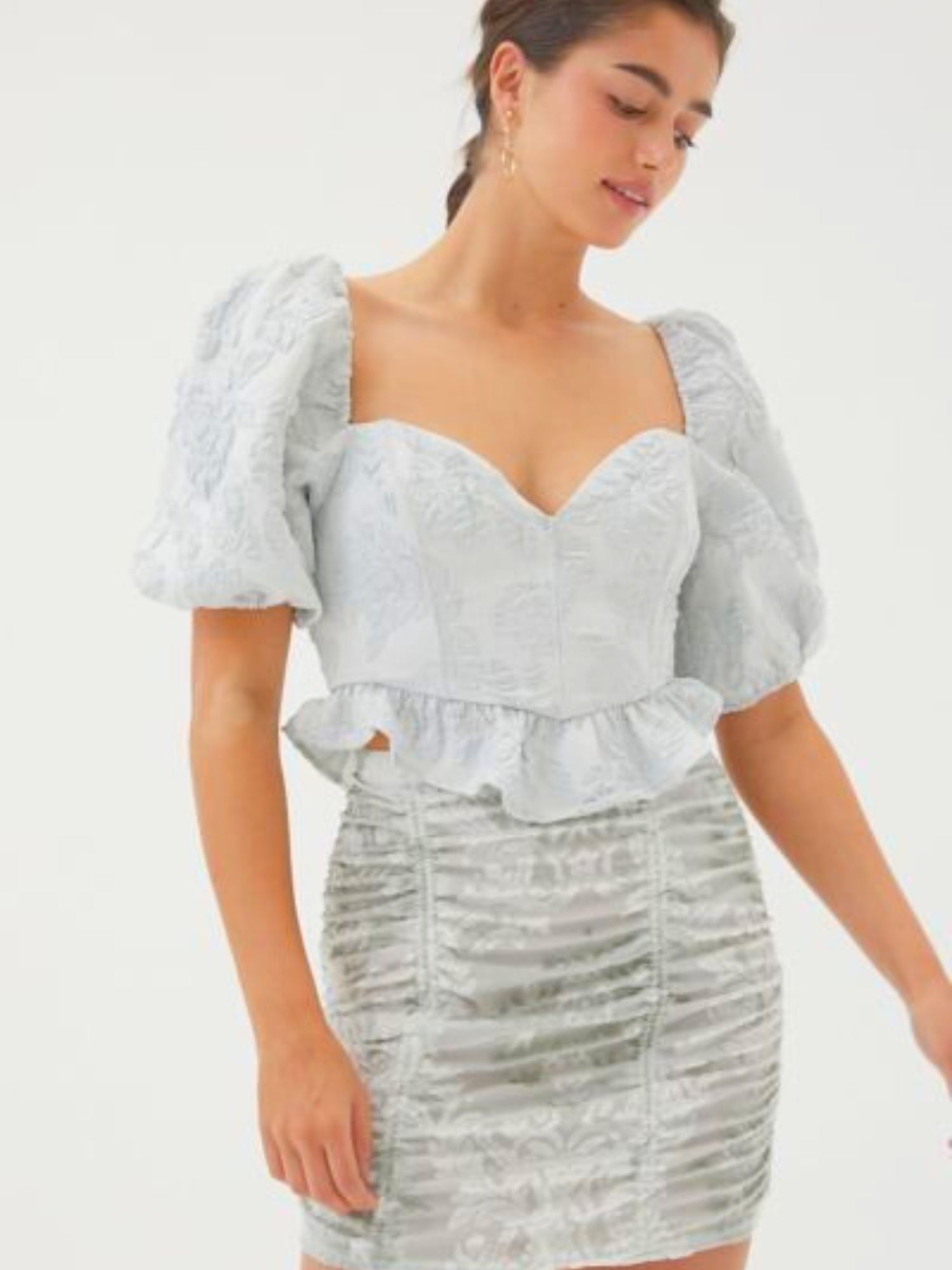 The Lydia Crop Top - The Lydia Crop Top by For Love & Lemons is a fairytale crop top MUST HAVE. Features puff sleeves, a light blue & silver jacquard fabric with ruffle detail. This top features a back zipper with a top button closure and boning on the fr