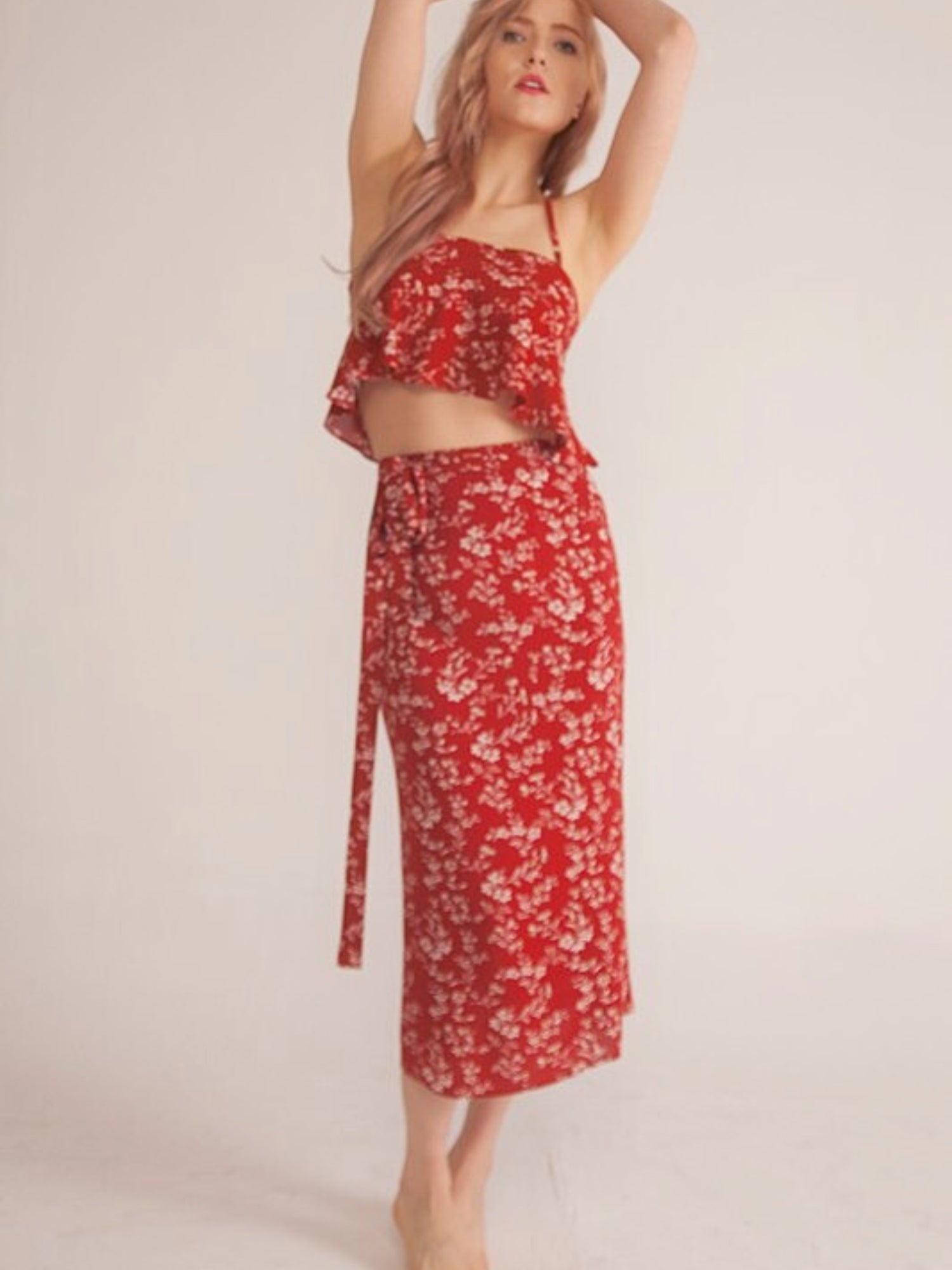 The Paradise Camisole Top - Let's have a love core spring in The Paradise Camisole Top. Made in a rust shade of red and features white floral print. This top is a tie front closure which allows you to adjust the top depending on how much coverage you're l