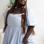 A light blue taffeta midi dress