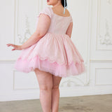 A pink lace party dress with short sleeves and tulle skirt to create a dreamy puff dress.