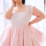 Pale pink cotton mini dress with a tulle and lace puff skirt.