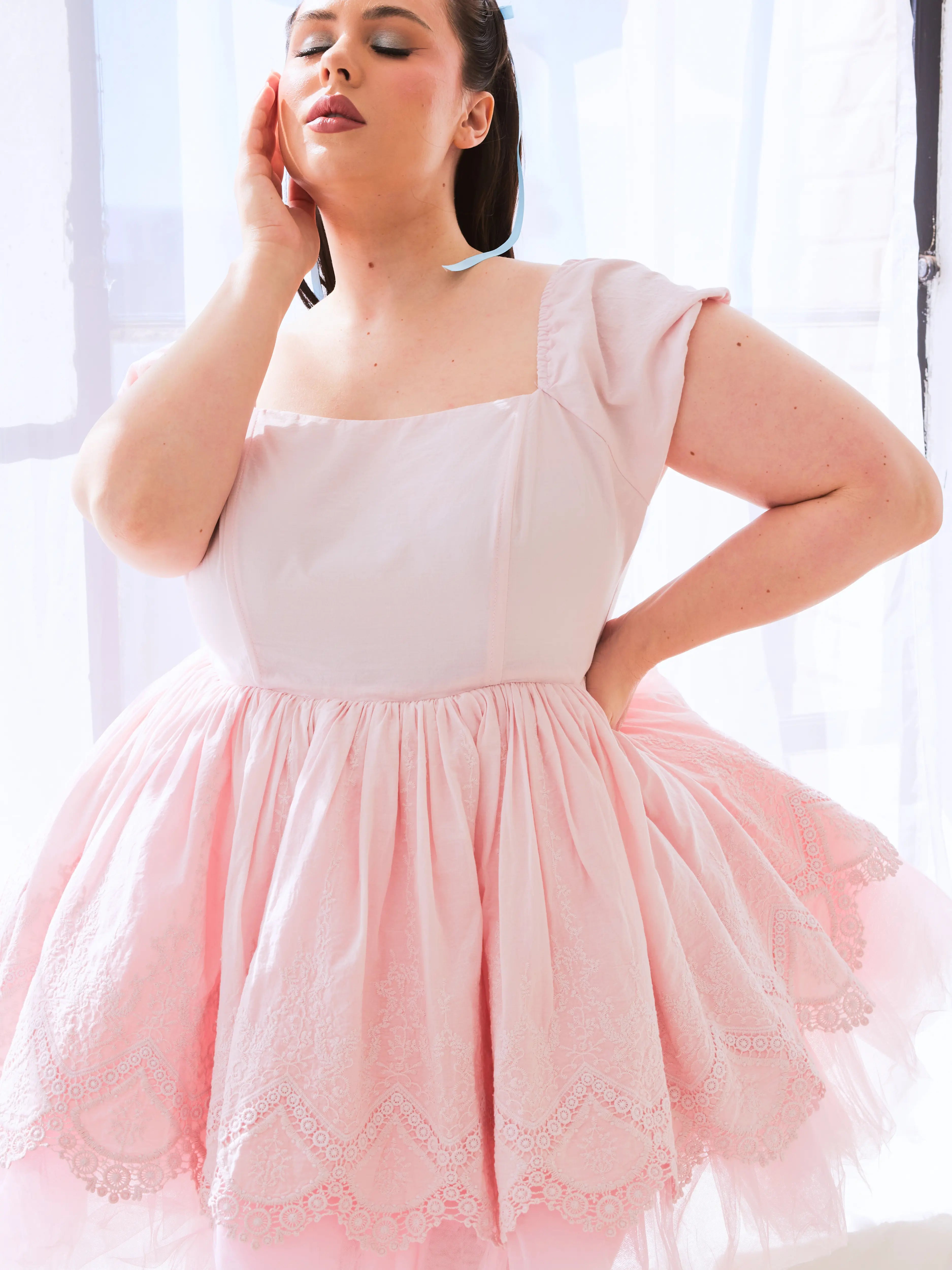 Pale pink cotton mini dress with a tulle and lace puff skirt.