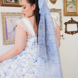 an extra large hair bow with a light blue toile print. Paired with the Blue Toile Angel Dress