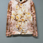 Flat lay of The Twilight Bloom Sleeper Hoodie on hanger, showcasing front floral design. A cozy, romantic hoodie top for everyday wear.