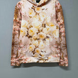 Flat lay of The Twilight Bloom Sleeper Hoodie on hanger, showcasing front floral design. A cozy, romantic hoodie top for everyday wear.