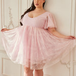 Pink lace dress featuring flutter sleeves and a flared skirt in a charming design