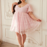 A pink lace dress featuring puff sleeves and a sweetheart neckline for a cute look