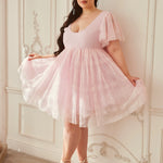 Soft pink tulle dress with flutter sleeves and sweetheart neckline.