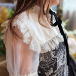 Elegant Ciela Snow White Shrug with contrasting lace trim collar and black embroidered bodice