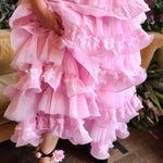 Frilly pink Dahlia Ruffle Skirt with tiers and snap closure buttons, close up photo.