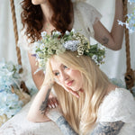 Romantic Dauphine Lace Gown worn with floral crown, showcasing lace detail and soft sleeves, perfect for weddings or garden parties.