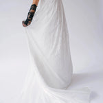 Flowing train of Dauphine Lace Gown in motion, emphasizing the gown's ethereal lace and lightweight bridal design.
