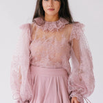 A dusty pink puff sleeve lace blouse with regal collar.