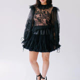 The Eleanor Midnight Black Lace Blouse, a gothic-style black lace top with a black tulle skirt and platform heels.