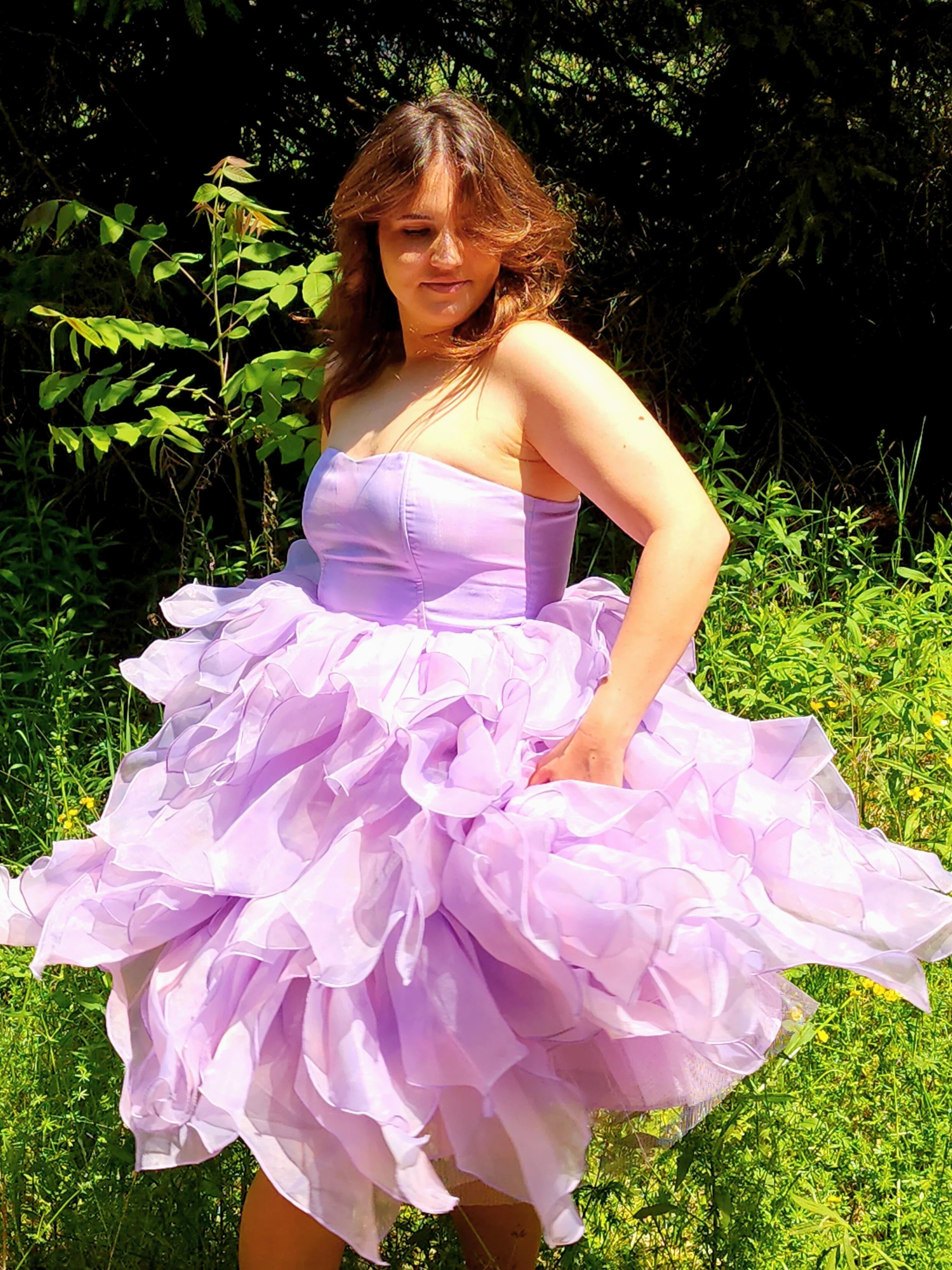 Lavender Eventyr Tulip Dress with voluminous, ruffled skirt, hand cut and hand dyed, worn by a woman in the forest for a fairytale look.