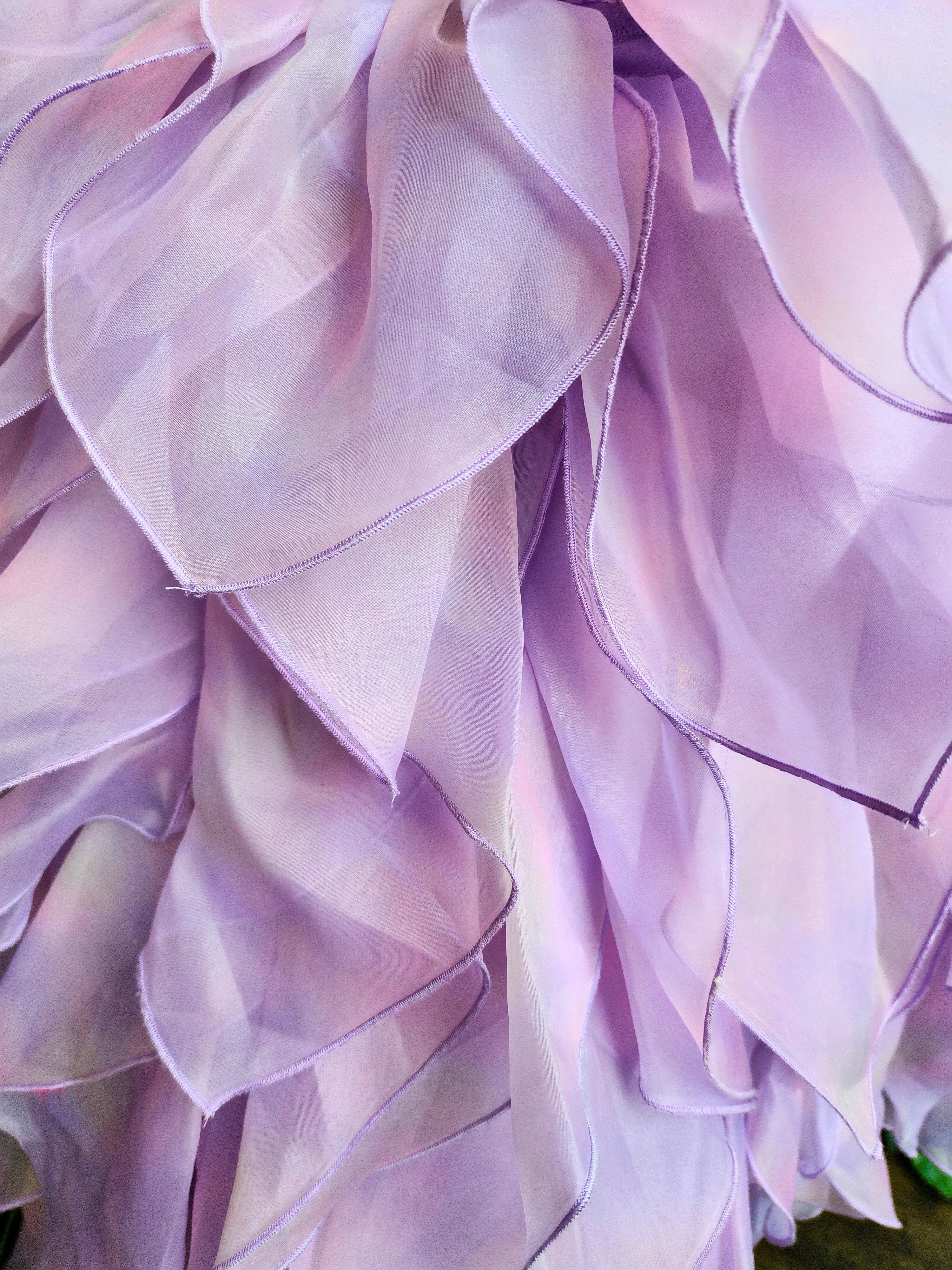 Delicate lavender flower petals highlight the hand cut and hand dyed Eventyr Tulip Dress