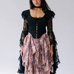 The Guineveres Revenge Lace Corset Top, made with delicate black lace to create dramatic billowing sleeves. 