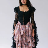 The Guineveres Revenge Lace Corset Top, made with delicate black lace to create dramatic billowing sleeves. 