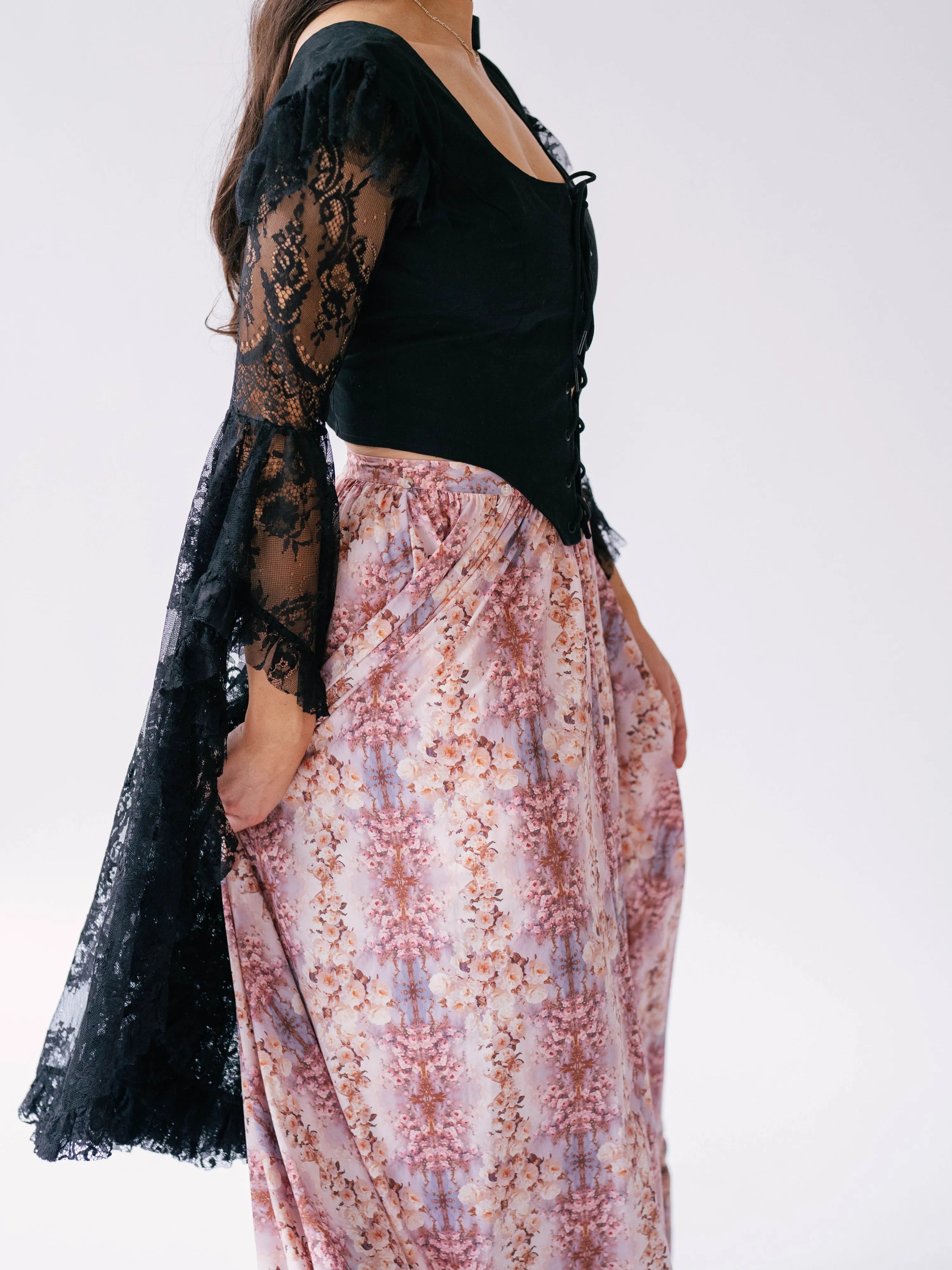 Victorian inspired fashion corset top, crafted with delicate black lace and features dramatic extra long sleeves.