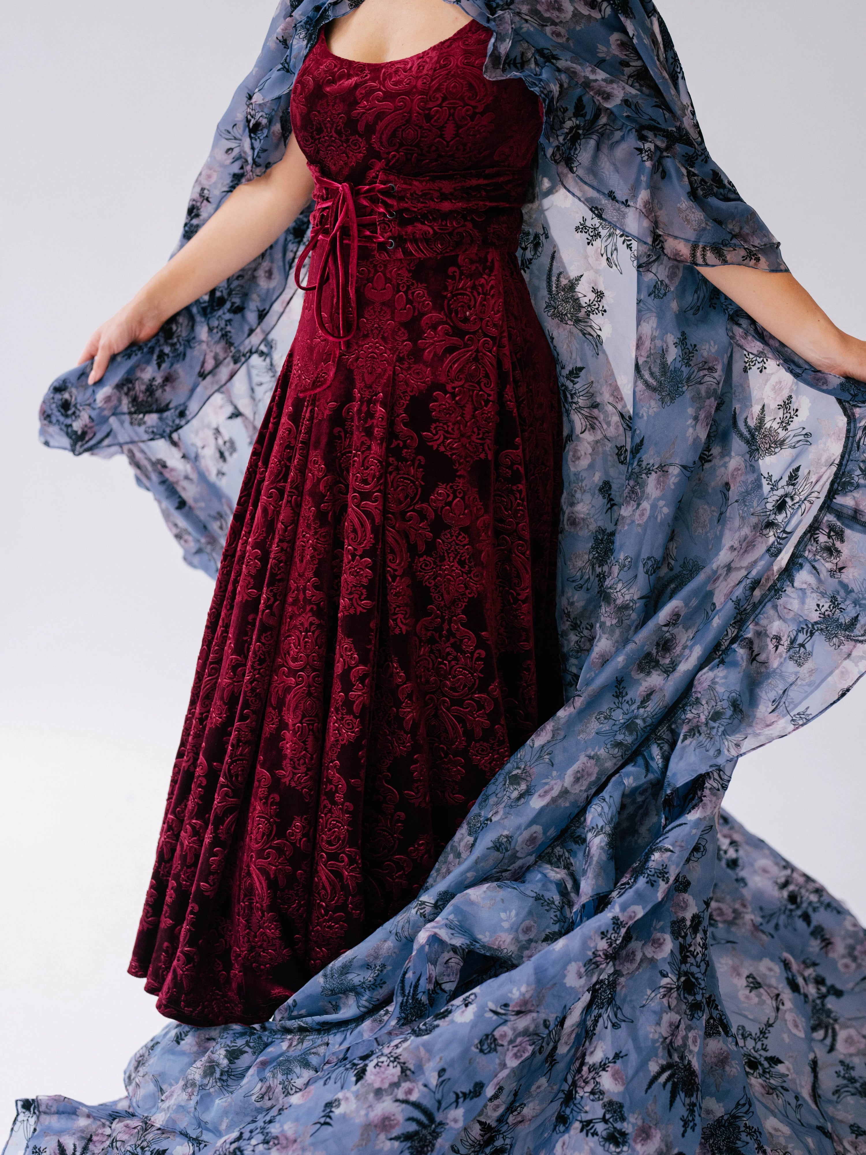 Burgundy velvet  midi dress with a empire waist bodice and removable belt, underneath a floor length victorian inspired cloak.
