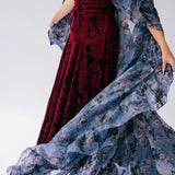 Red velvet midi dress with a flowing oversized poly organza cape.