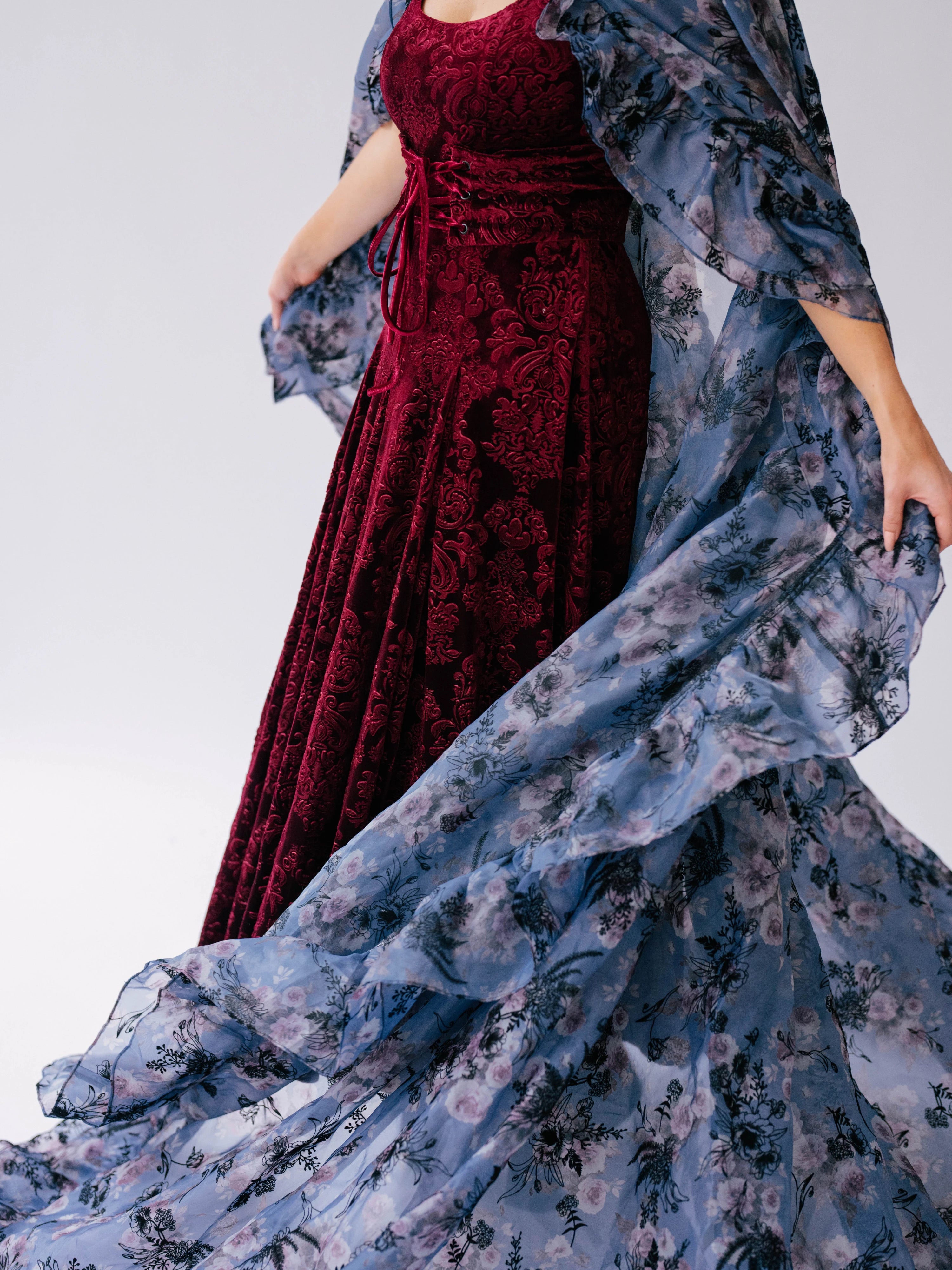 Red velvet midi dress with a flowing oversized poly organza cape.