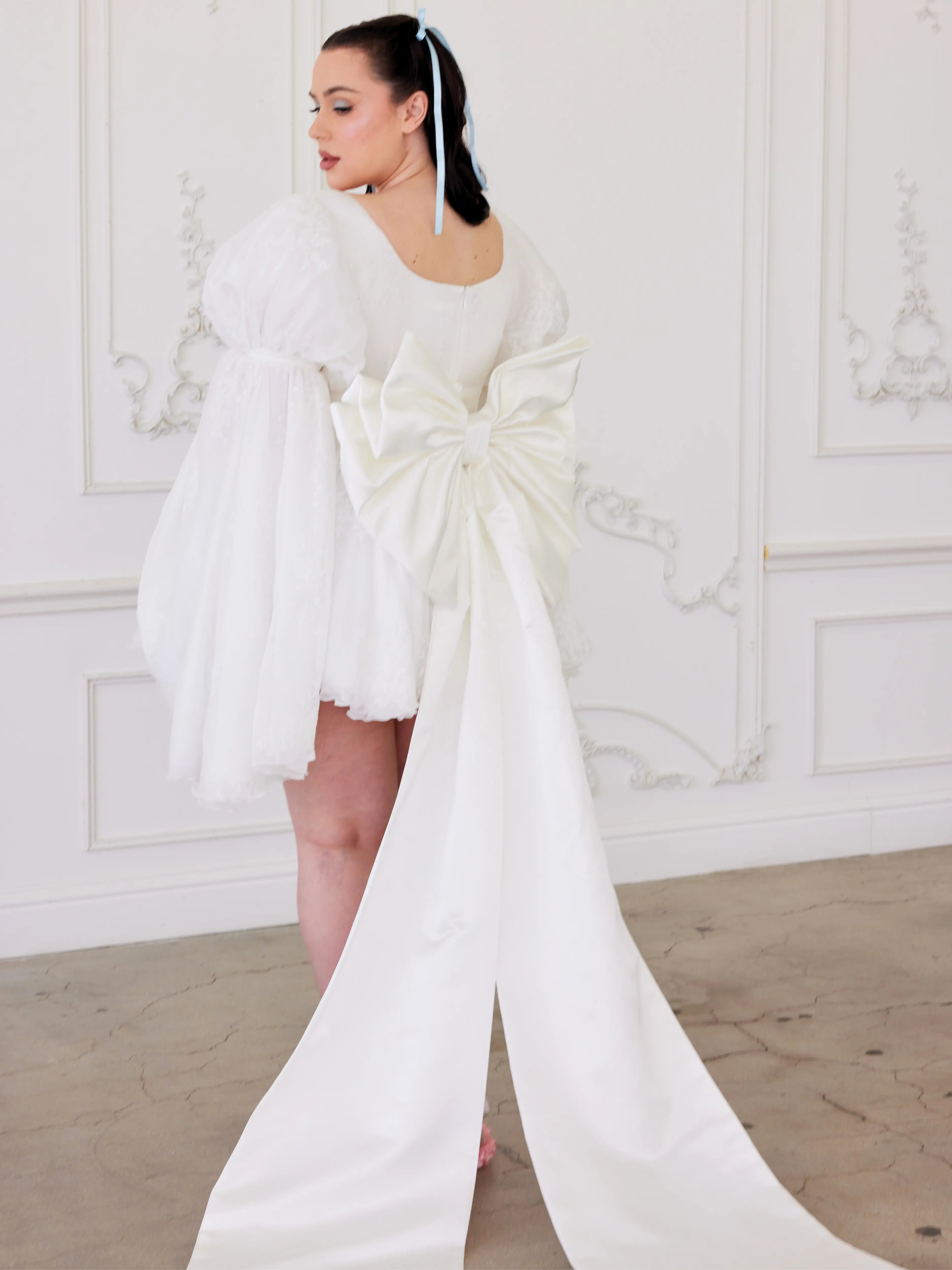 The Ivory Bridal Large Satin Bow Belt paired with The Ivory Fairy Puff Sleeve Dress.