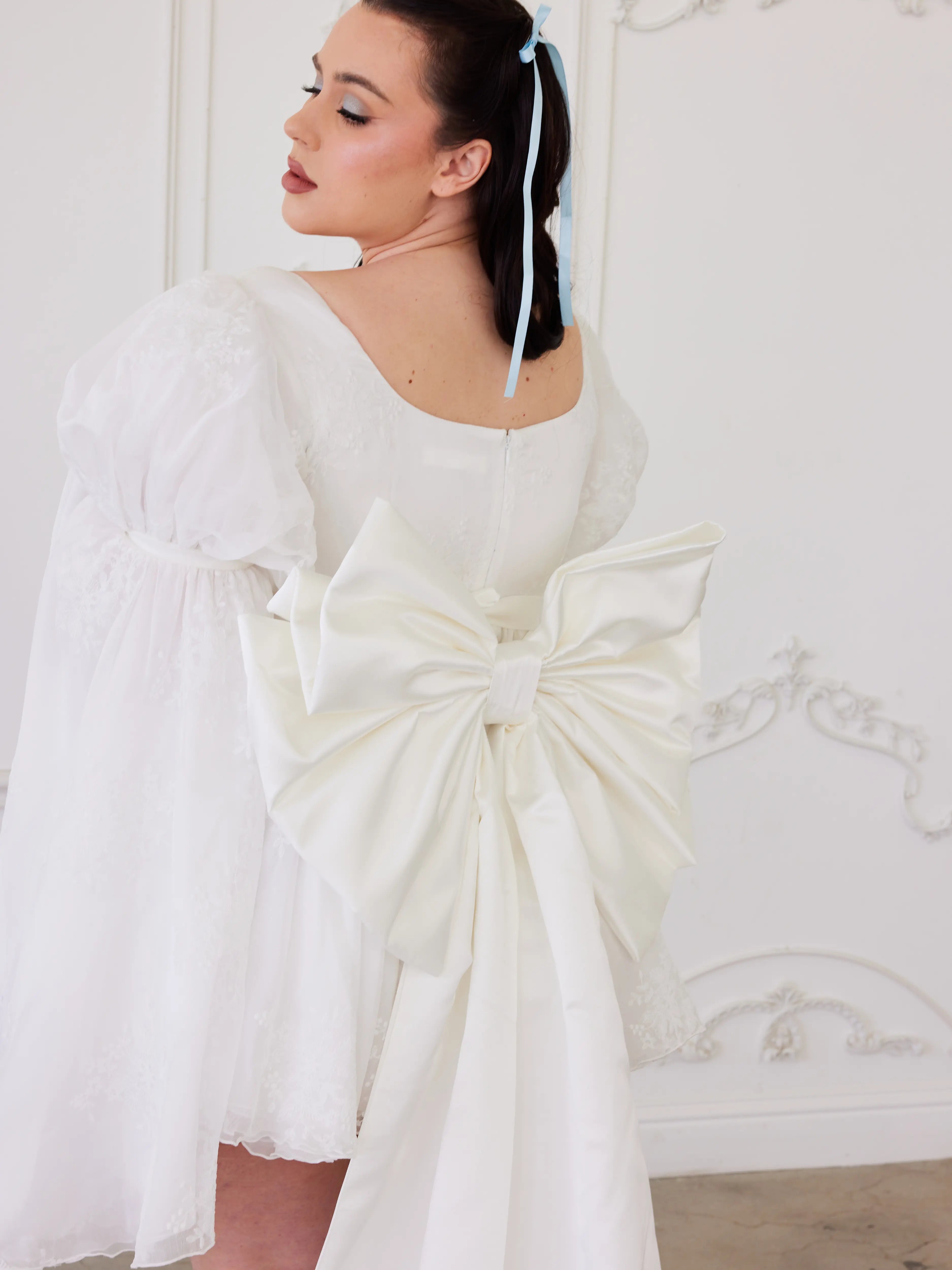 The Ivory Bridal Large Satin Bow Belt paired with the Ivory Fairy Puff Sleeve Dress for a unique wedding dress ensemble.