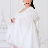 The Ivory Fairy Puff Sleeve Dress paired with The Bridal Large Satin Bow Belt for a bridal look.