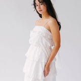 White tiered ruffle dress with thin straps and The Ivory Grand Bridal Hair Bow