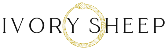 The Ivory Sheep Collection Logo with our gold Ouroboros emblem 