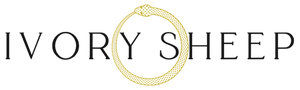 The Ivory Sheep Collection Logo with our gold Ouroboros emblem 