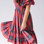 Red plaid corset midi dress with puffed sleeves and tiered ruffle skirt.