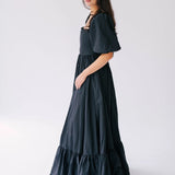 Black tiered victorian styled maxi dress with puff sleeves and corset boned bodice.