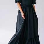 The Josephine Renaissance Gown in Raven is a black taffeta corset maxi dress with puff sleeves and a tiered ruffle hem.