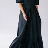 The Josephine Renaissance Gown in Raven is a black taffeta corset maxi dress with puff sleeves and a tiered ruffle hem.