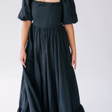 Black taffeta maxi dress with puff sleeves, synthetic boned corset bodice and a ruffled hem.