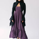 Purple midi dress with ruffled hem paired with a black shrug bell sleeve black lace jacket.