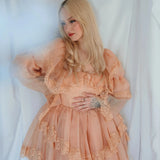 Model poses with hand on waist in the Midnight Symphony Mini Gown, emphasizing its whimsical silhouette and soft lace details.