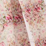 Floral fabric with pink roses and delicate blooms in a romantic vintage pattern called Rosewater.