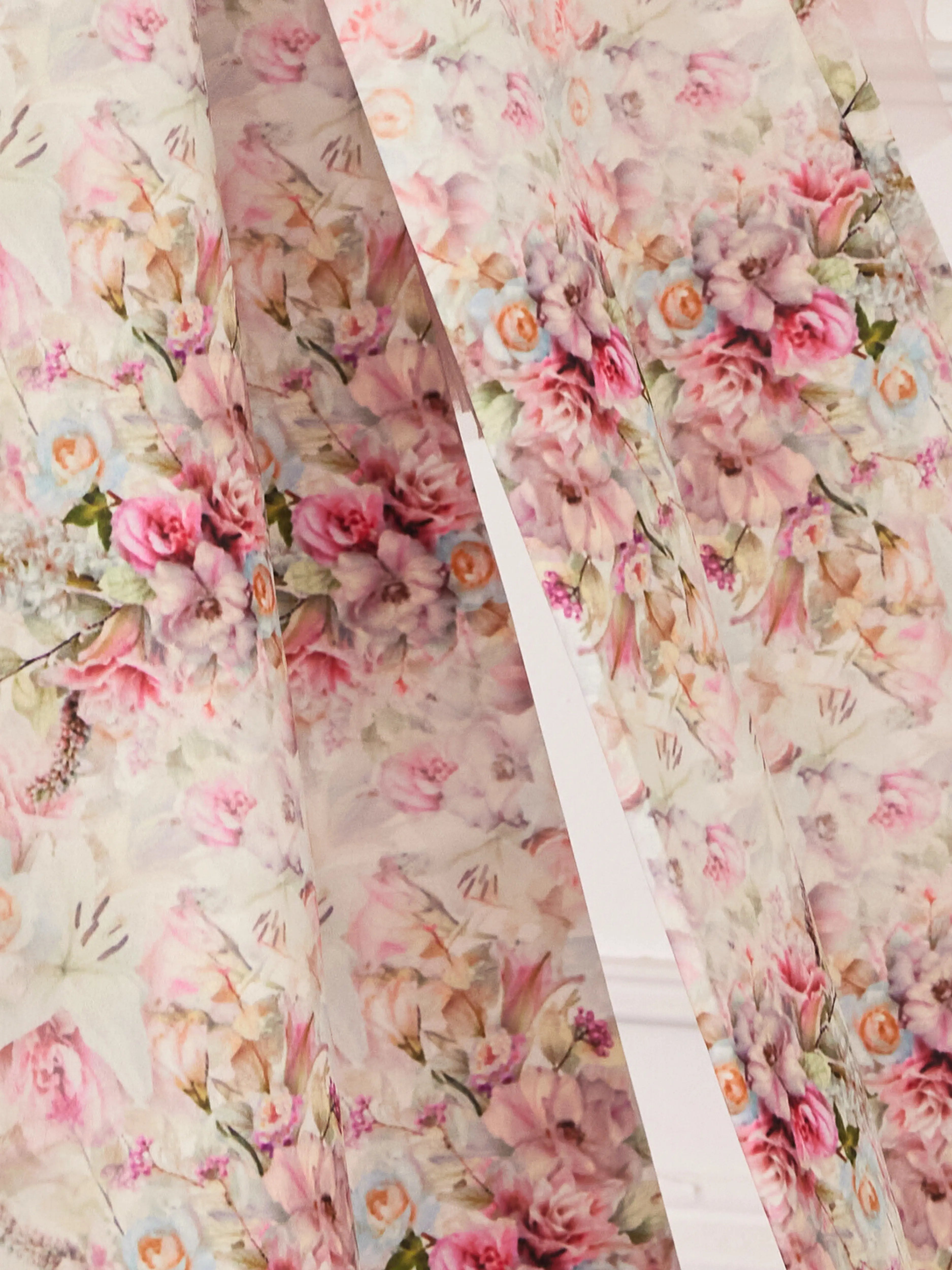 Floral fabric with pink roses and delicate blooms in a romantic vintage pattern called Rosewater.